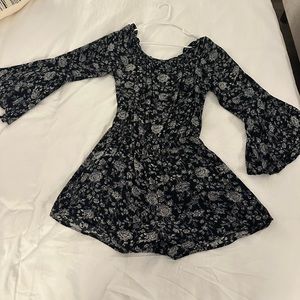 Dainty Hooligan black and white floral romper with bell sleeves